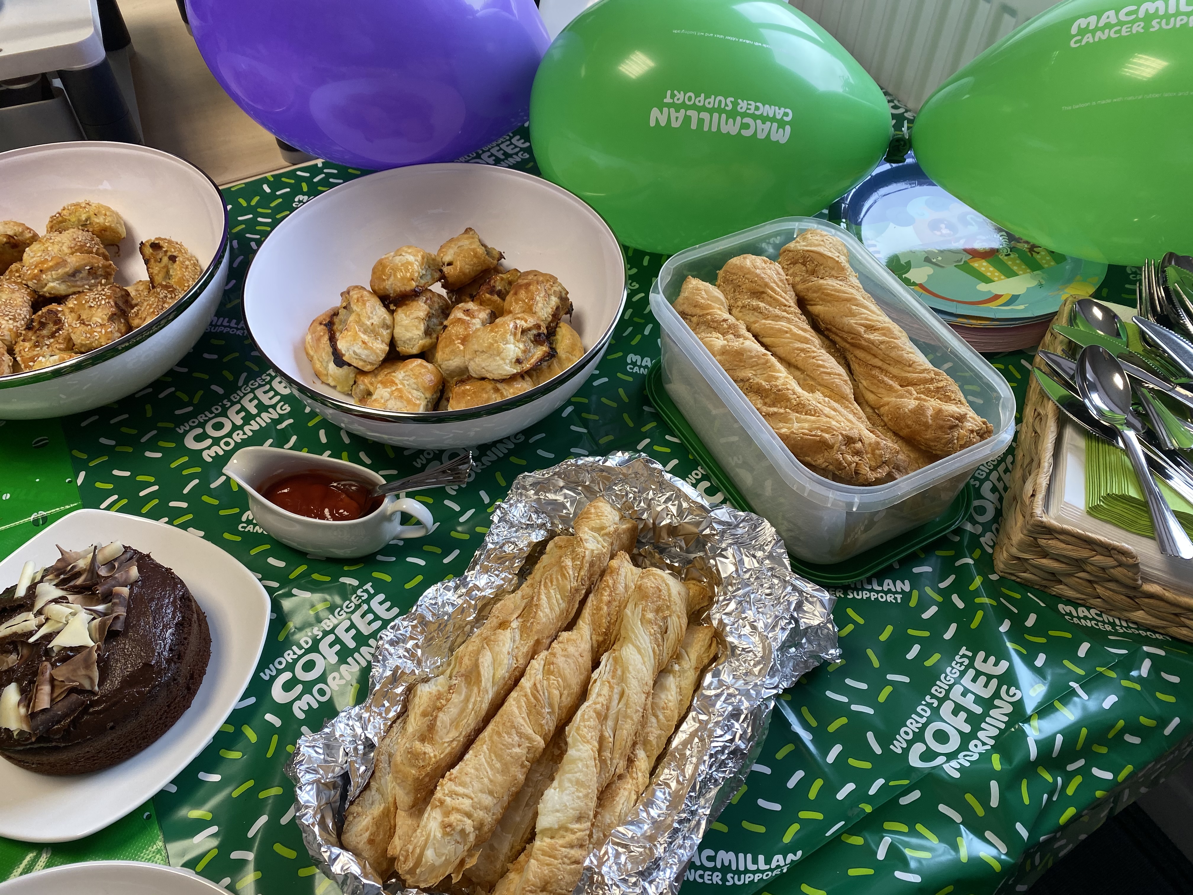 COFFEE WAS POURED AND CAKE WAS EATEN RAISING MONEY FOR MACMILLIAN CANCER SUPPORT CHARITY 